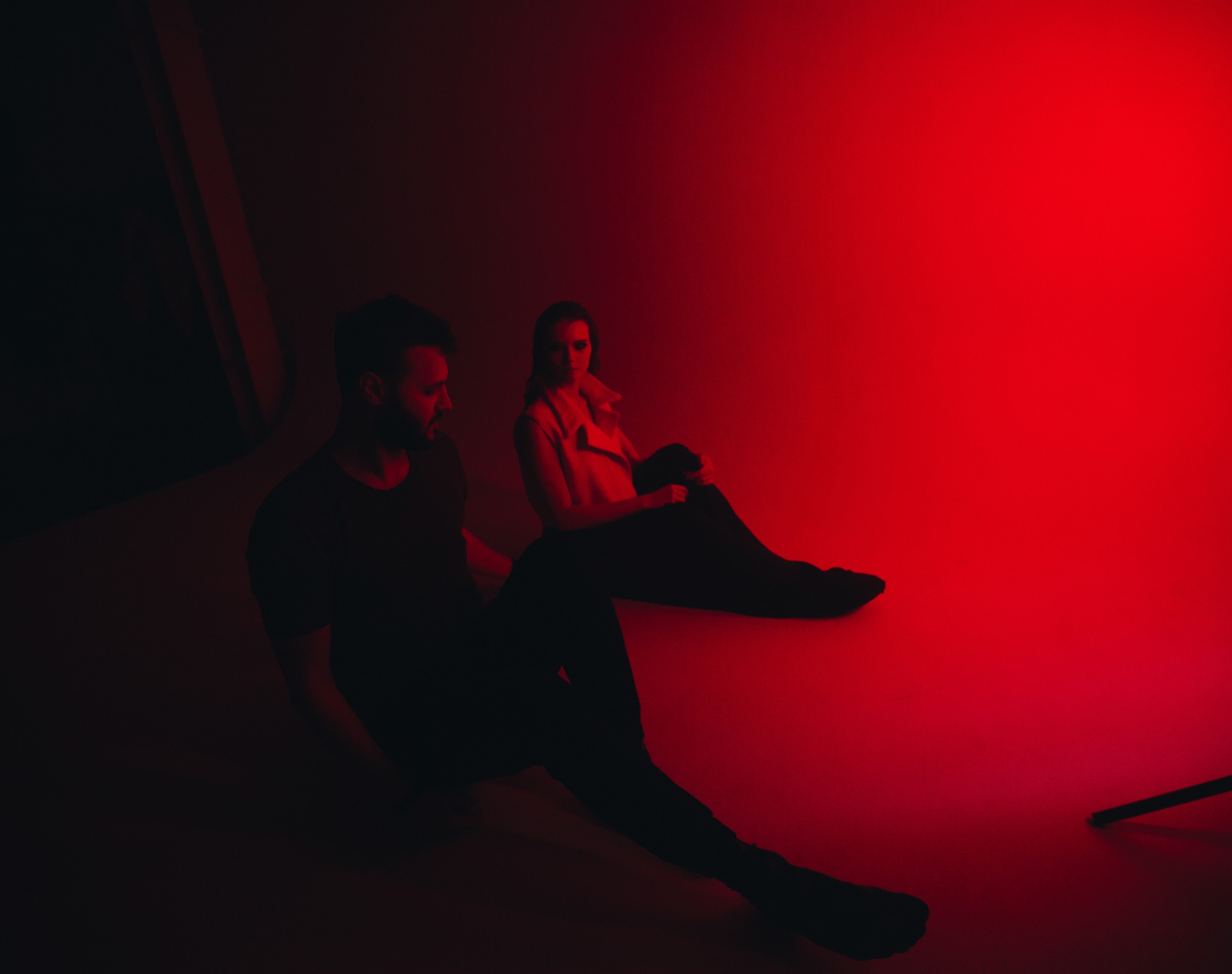 Two people with red lighting